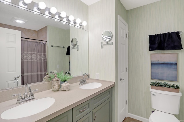 bathroom featuring a shower with shower curtain, vanity, and toilet