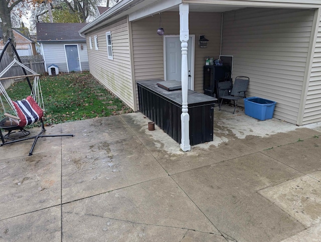 view of patio / terrace featuring a storage shed