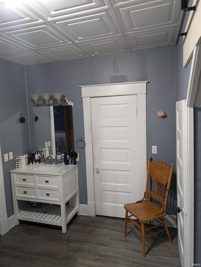 interior space with vanity and hardwood / wood-style flooring