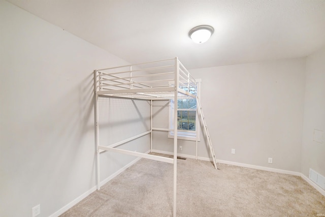 unfurnished bedroom featuring carpet