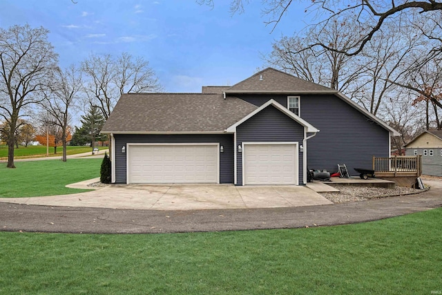 exterior space with a yard and a garage