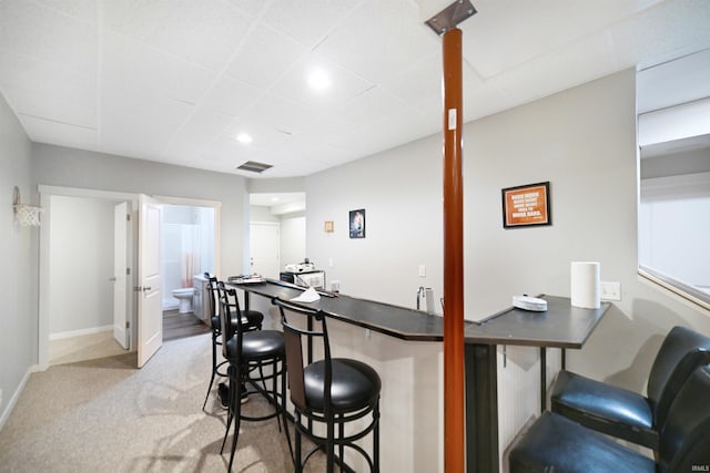 bar with light colored carpet