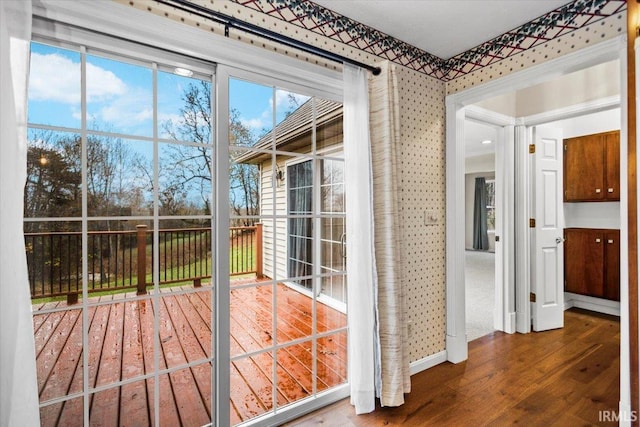 doorway with hardwood / wood-style floors