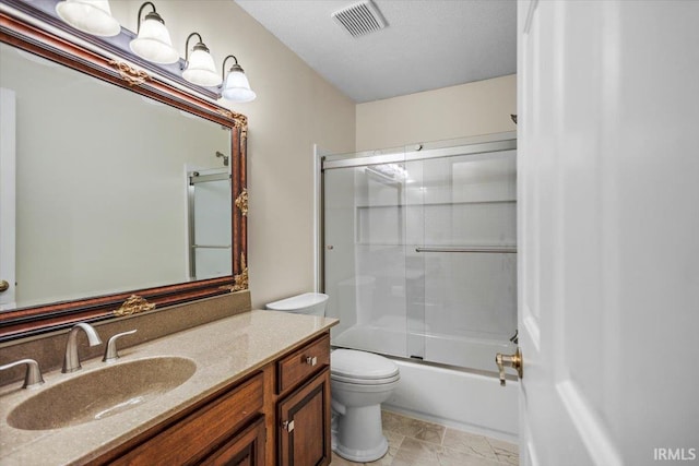 full bathroom with toilet, vanity, a textured ceiling, and combined bath / shower with glass door