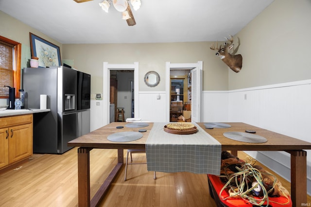 dining space featuring ceiling fan and light wood-type flooring