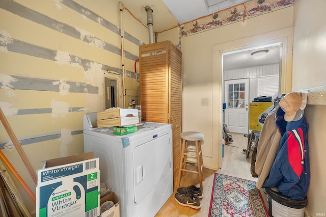 washroom featuring washer / clothes dryer and light hardwood / wood-style flooring