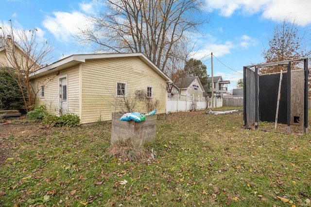 view of property exterior featuring a lawn