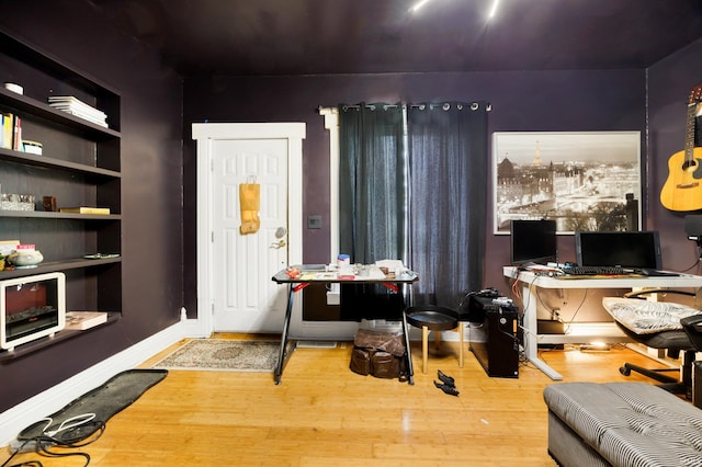 office area with hardwood / wood-style floors