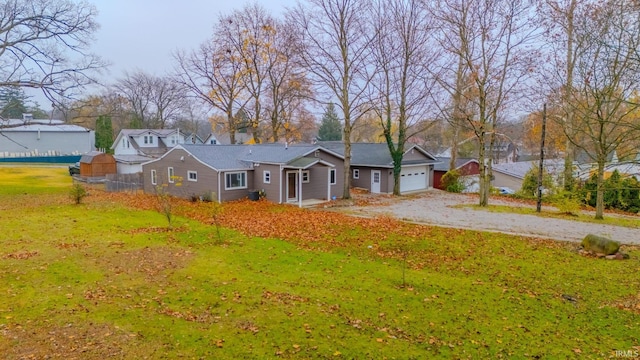 view of front facade with a garage and a front lawn