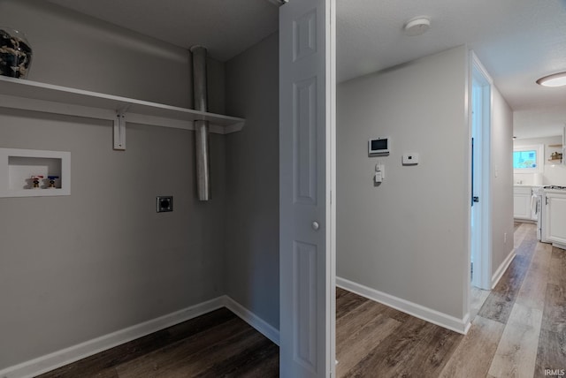 washroom with washer hookup, a textured ceiling, hardwood / wood-style flooring, and electric dryer hookup