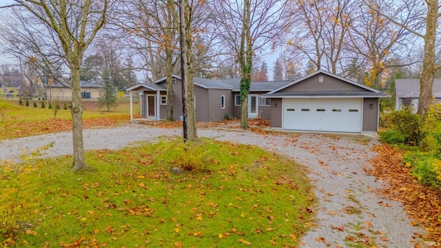 ranch-style house featuring a garage