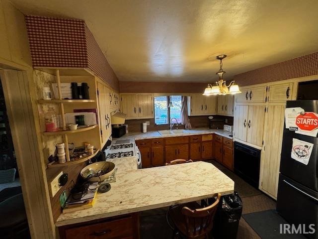 kitchen with sink, hanging light fixtures, kitchen peninsula, a chandelier, and black appliances