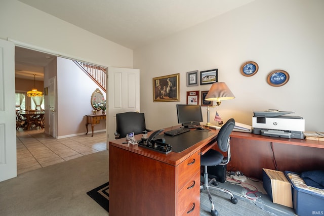 office space featuring lofted ceiling and light carpet