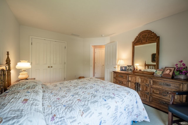 bedroom with carpet flooring and a closet