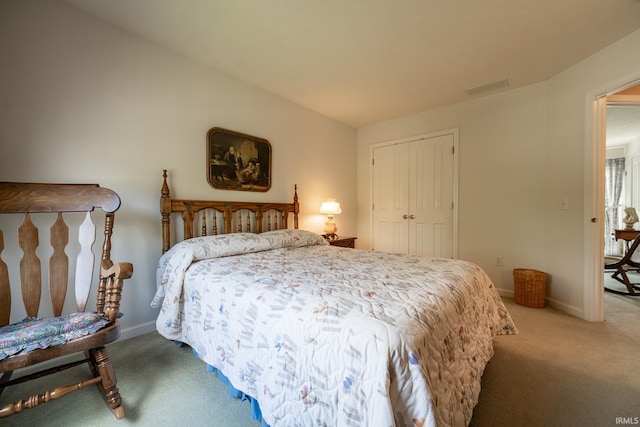 carpeted bedroom featuring a closet