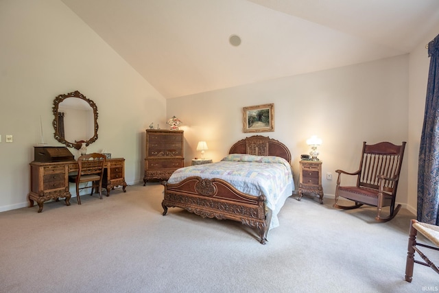 bedroom with lofted ceiling and light carpet