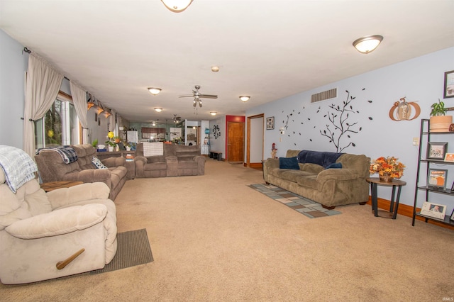 living room with carpet and ceiling fan