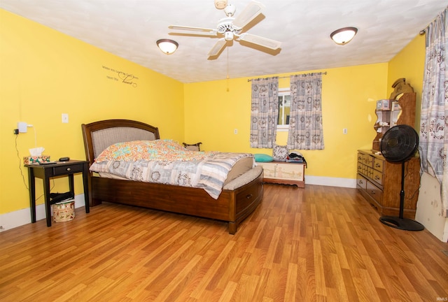 bedroom with ceiling fan and light wood-type flooring