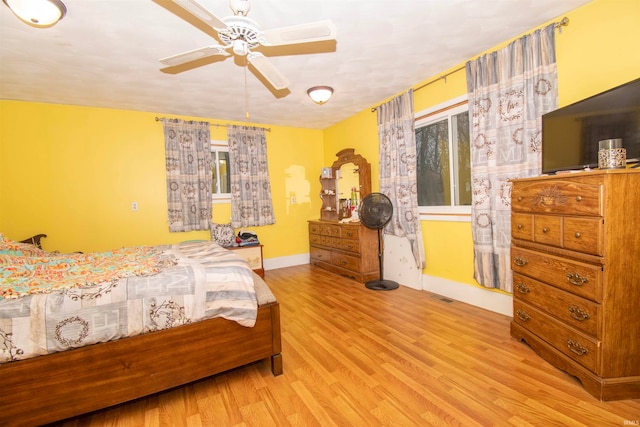 bedroom featuring ceiling fan and light hardwood / wood-style floors