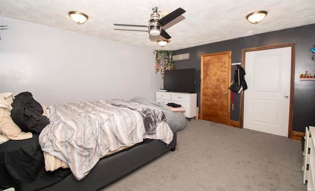 carpeted bedroom with ceiling fan