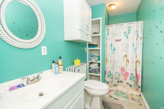 bathroom with tile patterned flooring, vanity, toilet, and curtained shower