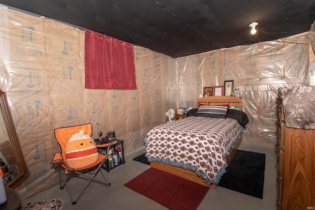 bedroom with concrete flooring