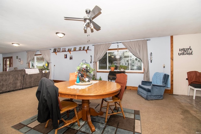 dining area featuring carpet flooring, ceiling fan, and plenty of natural light