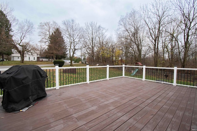 wooden terrace featuring grilling area