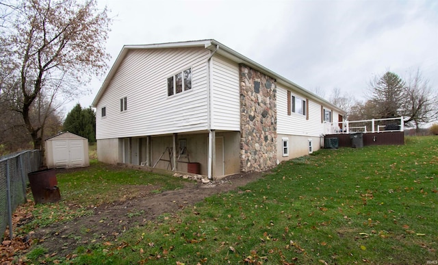 view of property exterior featuring a yard and a shed