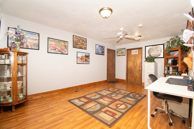 office space with ceiling fan and light wood-type flooring