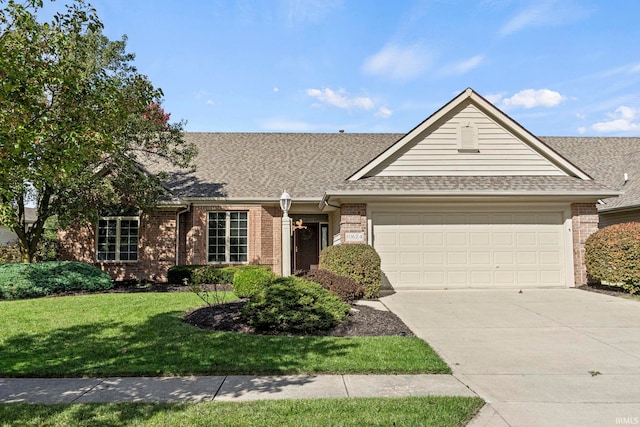 single story home featuring a front yard and a garage