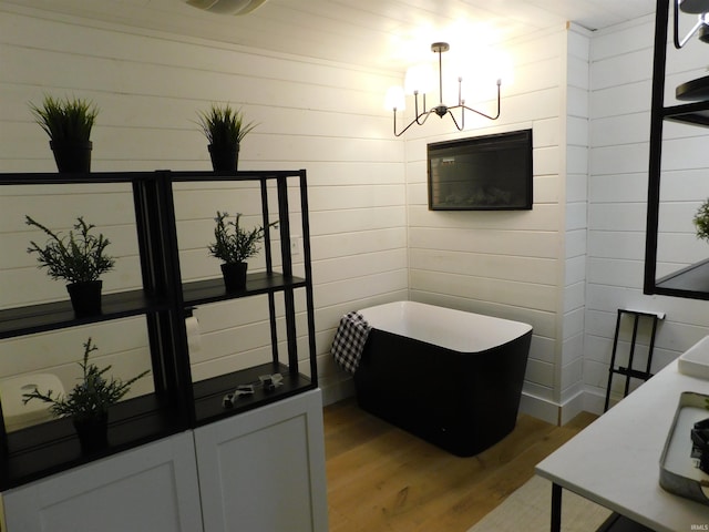 interior space featuring a chandelier and hardwood / wood-style floors