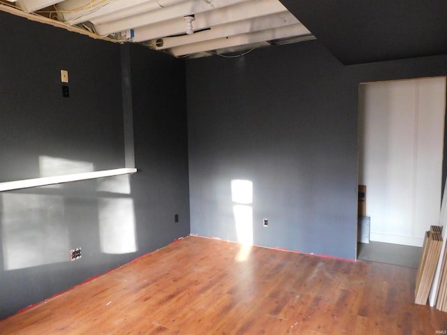 spare room featuring dark wood-type flooring