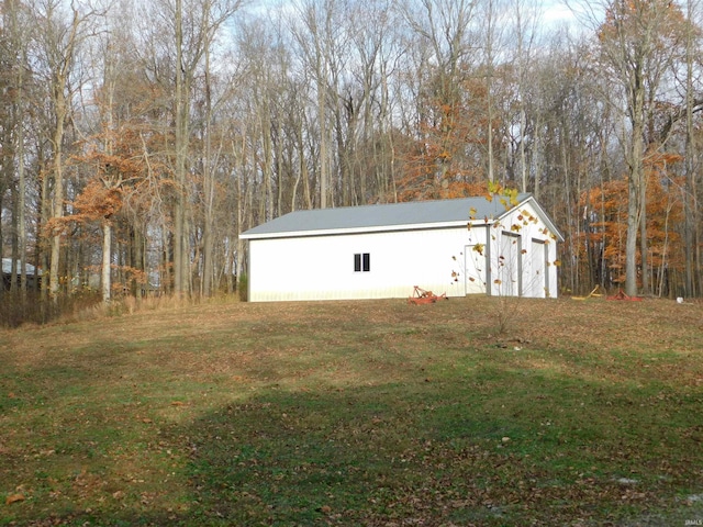 view of outbuilding with a lawn