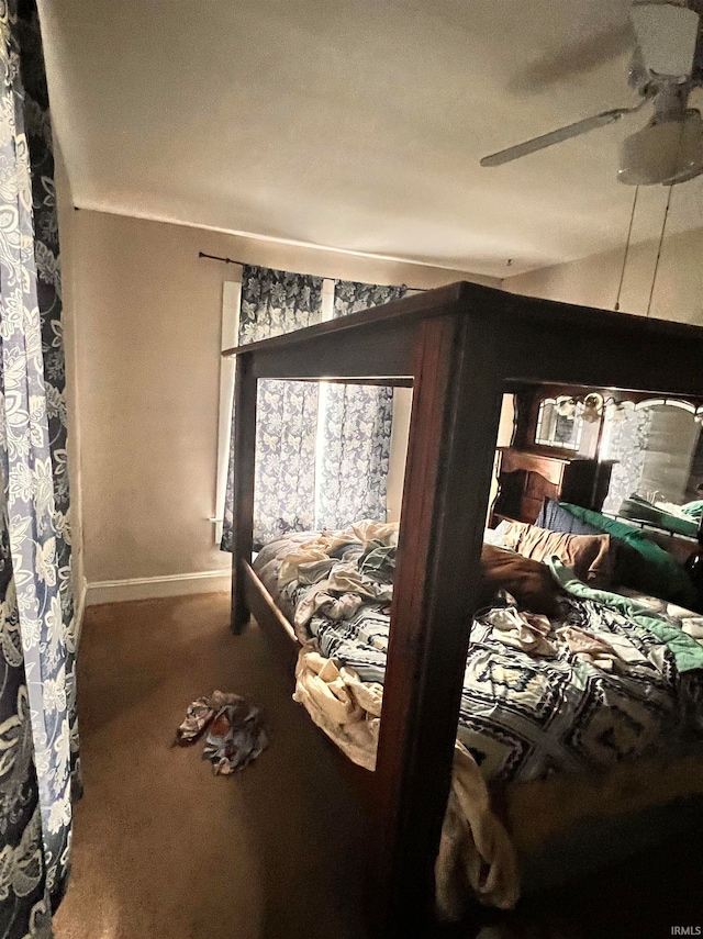 bedroom with ceiling fan, vaulted ceiling, carpet, and baseboards