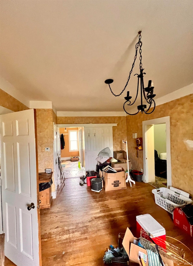 dining room featuring a notable chandelier and wood finished floors