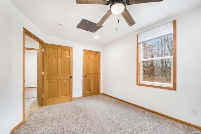 unfurnished bedroom featuring baseboards, ceiling fan, and carpet flooring