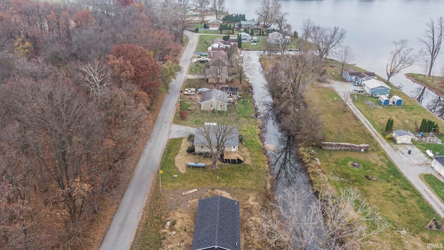 birds eye view of property featuring a water view and a residential view