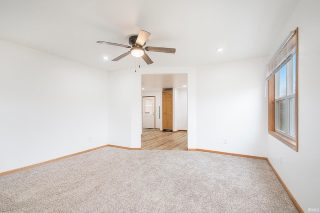 empty room featuring a ceiling fan, recessed lighting, baseboards, and light carpet