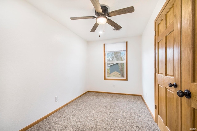 unfurnished bedroom with visible vents, light colored carpet, baseboards, and ceiling fan