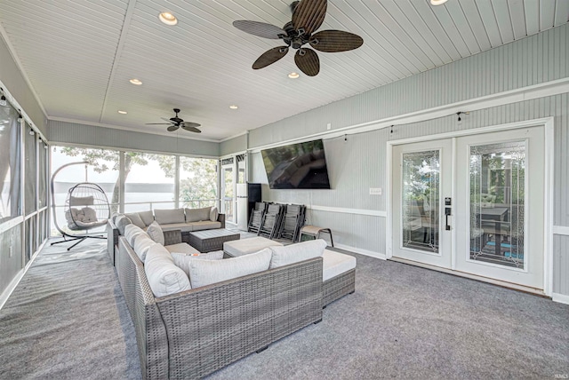 sunroom featuring ceiling fan, french doors, and wood ceiling