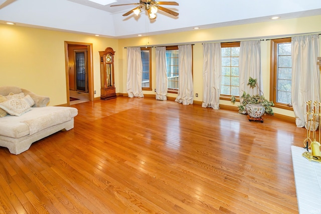 living room featuring light wood-type flooring and ceiling fan