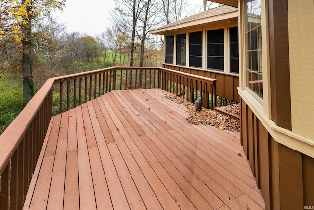 deck with a sunroom