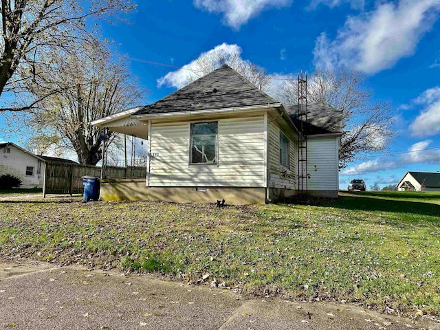 view of home's exterior featuring a lawn