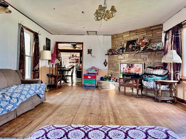 living room featuring hardwood / wood-style flooring and a chandelier