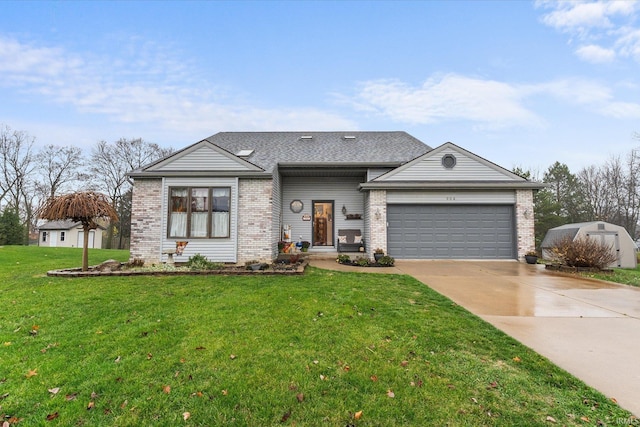 view of front of home with a front yard and a garage