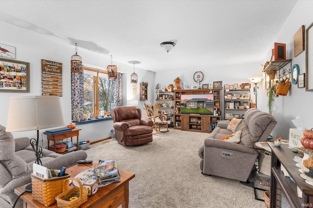 living room featuring carpet and a textured ceiling