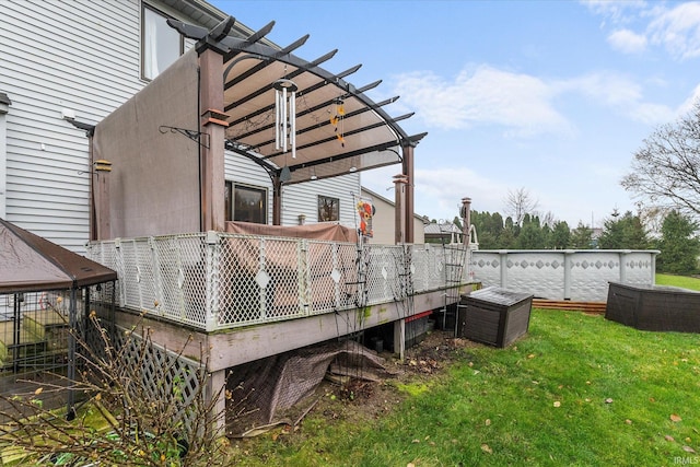 deck with a lawn and a pergola