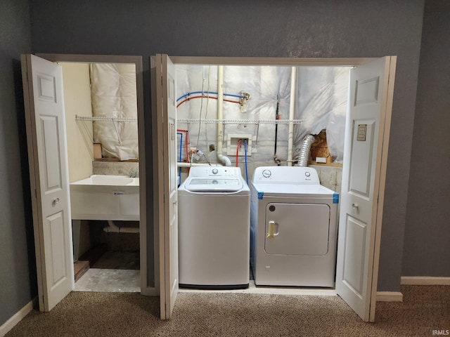 laundry area with carpet and washer and dryer