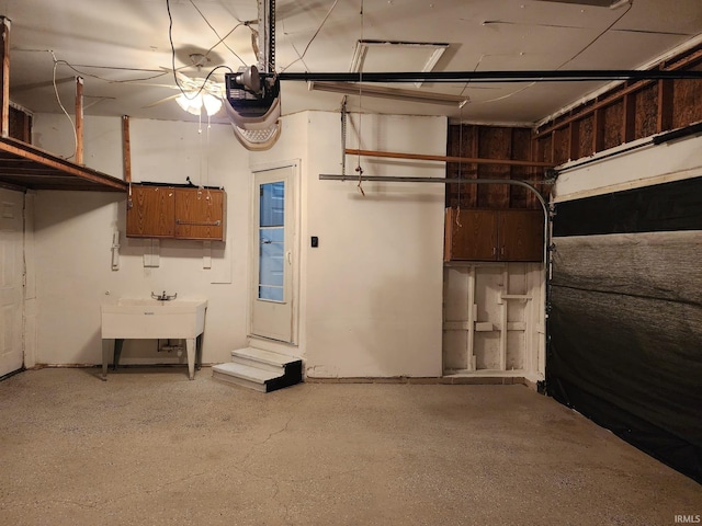 garage with sink and a garage door opener